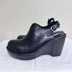 Black Leather upper body Born wedges with a plastic sole.